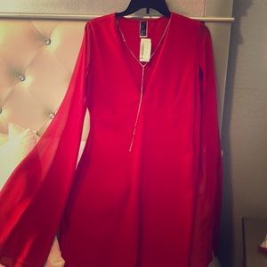 Red dress with gold long necklace